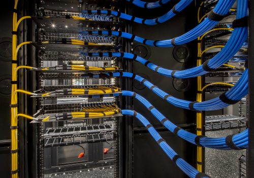 Fiber Optic and Cat 6 wiring in a server room.